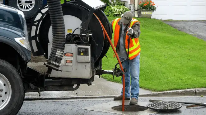 Technician using specialized drainage equipment for sewer line cleaning and foundation protection in Oakland, CA